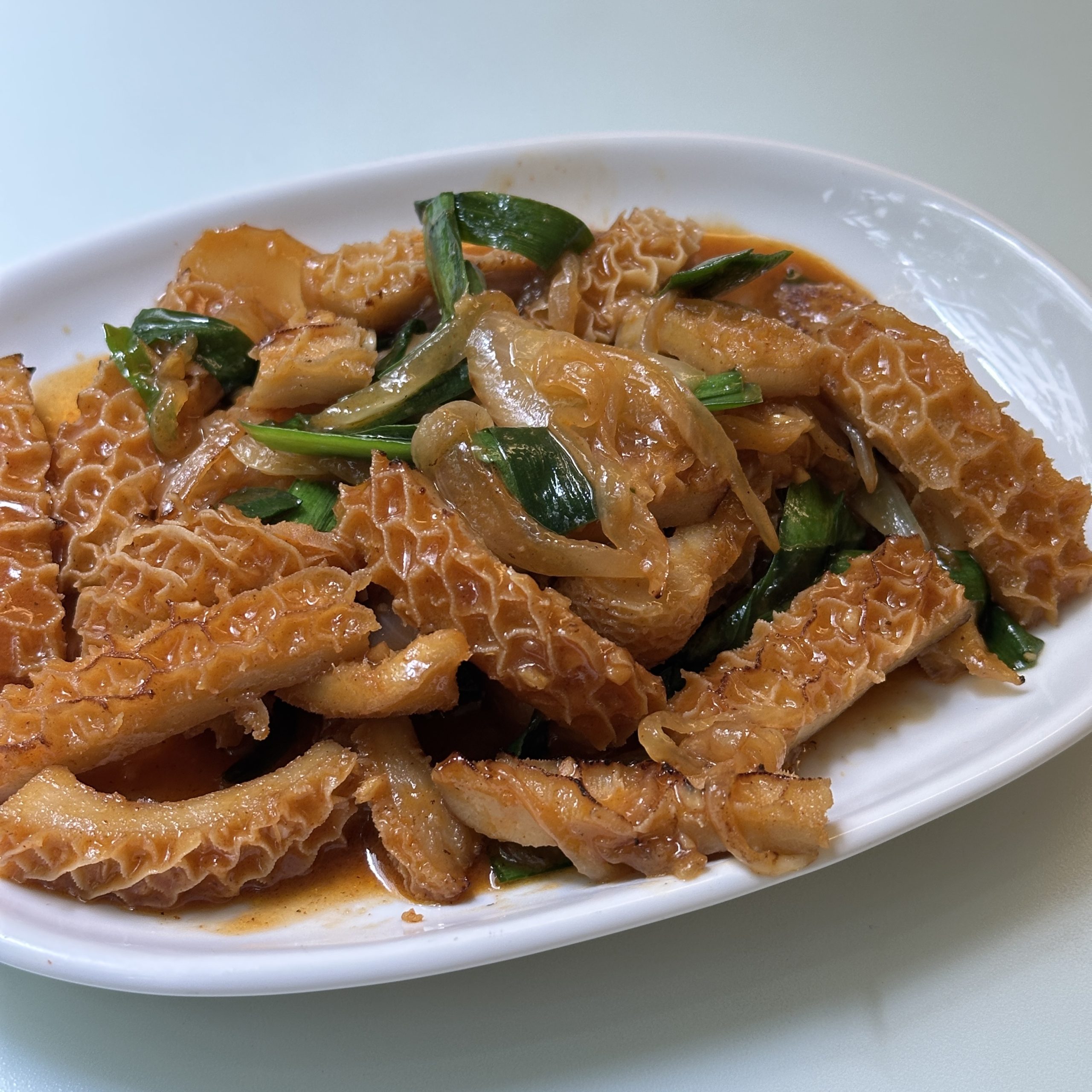 - 5月の旬菜 -<br />
牛ホルモンのピリ辛味噌炒め