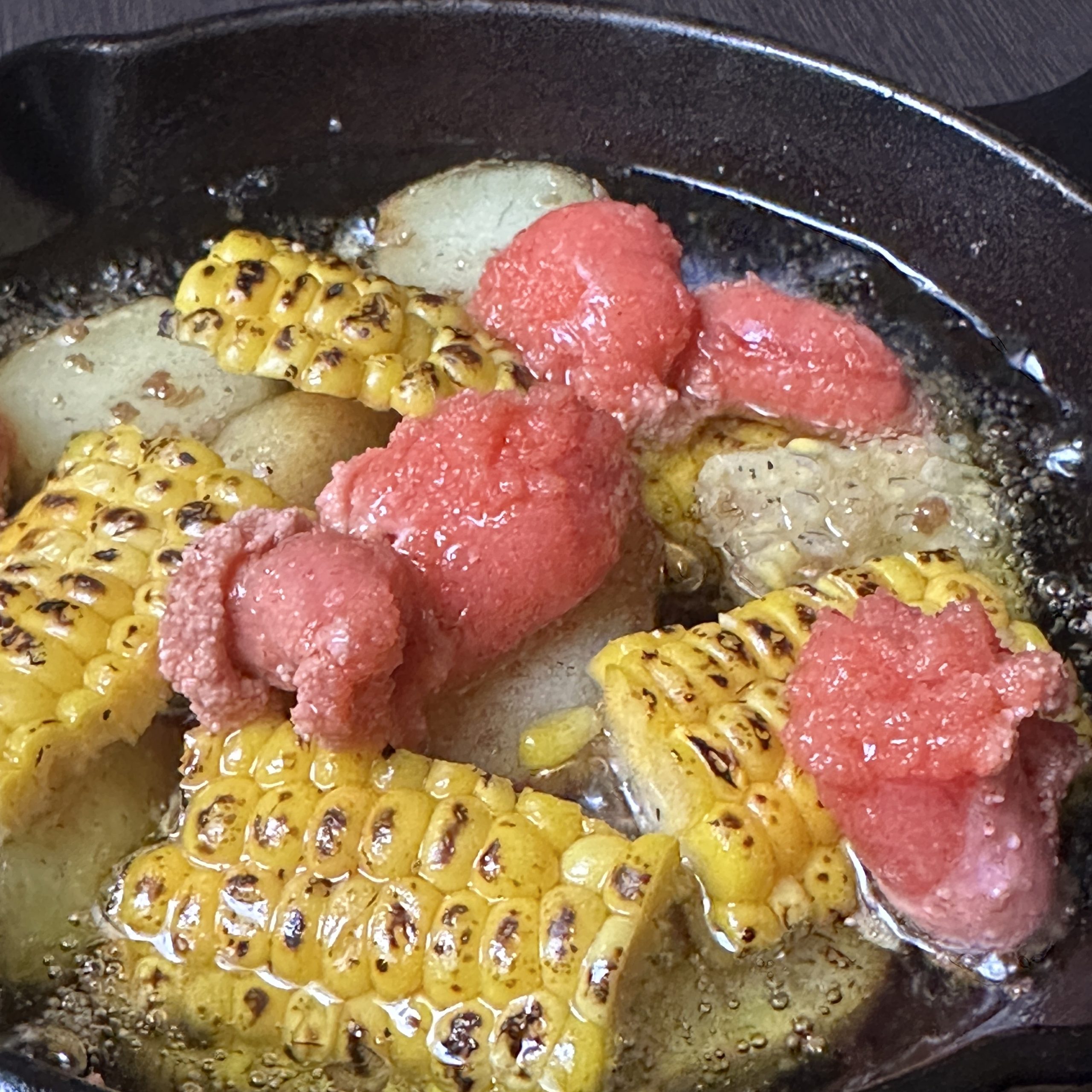 - 7月の旬菜 -<br />
明太子と焼きトウモロコシのアヒージョ